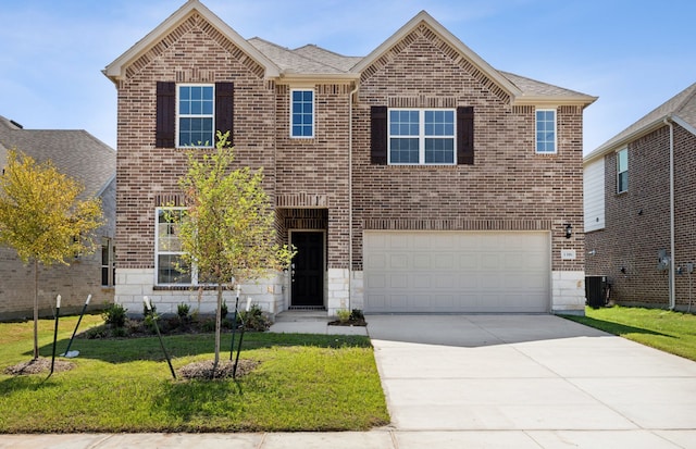 view of front of home featuring a garage, central air condition unit, and a front lawn