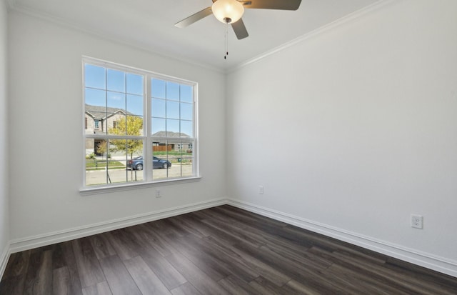 empty room featuring ornamental molding, dark wood-type flooring, and ceiling fan