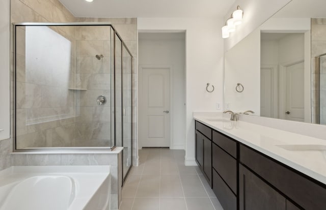 bathroom with tile patterned floors, vanity, and plus walk in shower