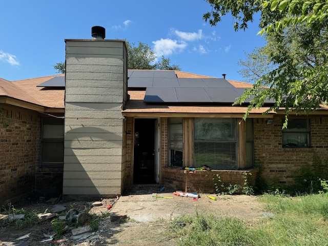 exterior space featuring solar panels