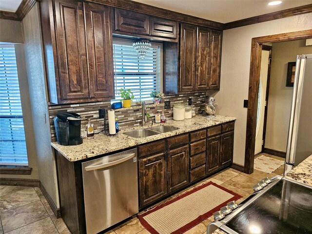 kitchen featuring sink, dark brown cabinets, and appliances with stainless steel finishes