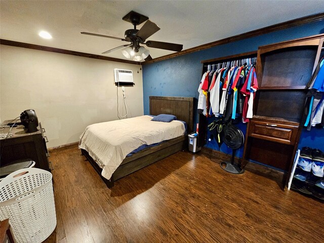 bedroom with ornamental molding, dark hardwood / wood-style floors, and ceiling fan