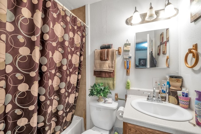 bathroom with shower / bath combination with curtain, toilet, and vanity