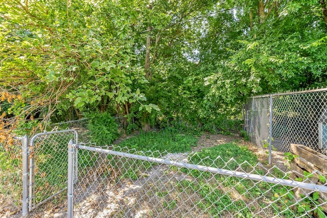 view of yard featuring a gate and fence