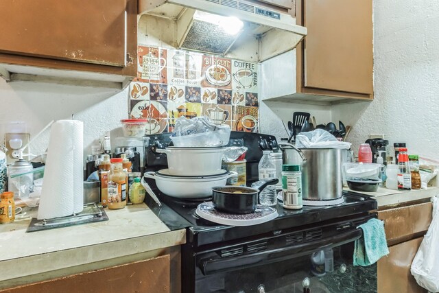 kitchen featuring custom range hood