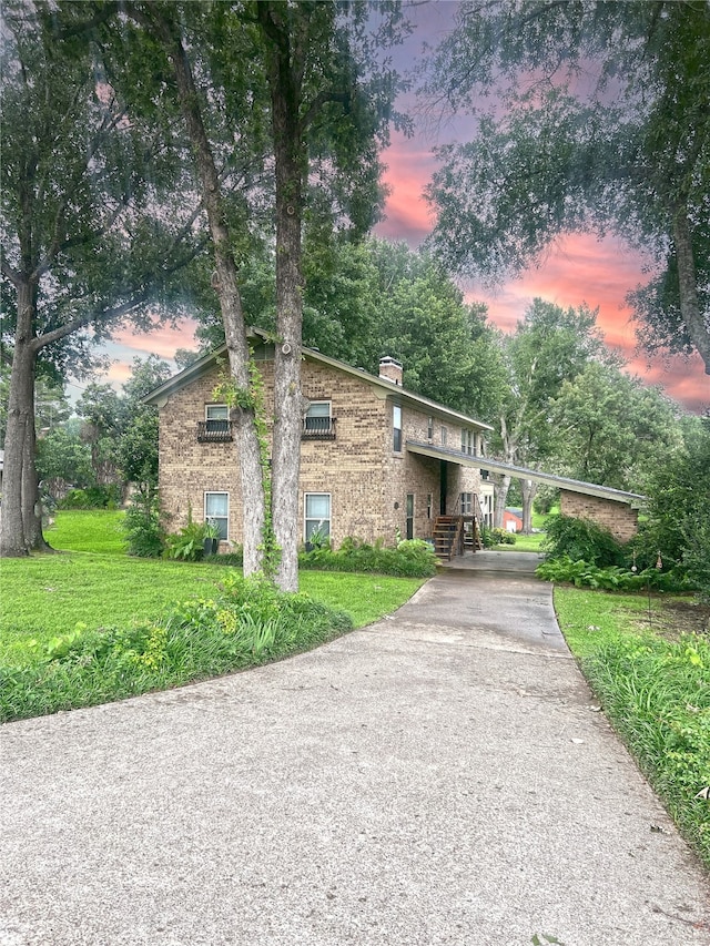 view of front of home with a yard