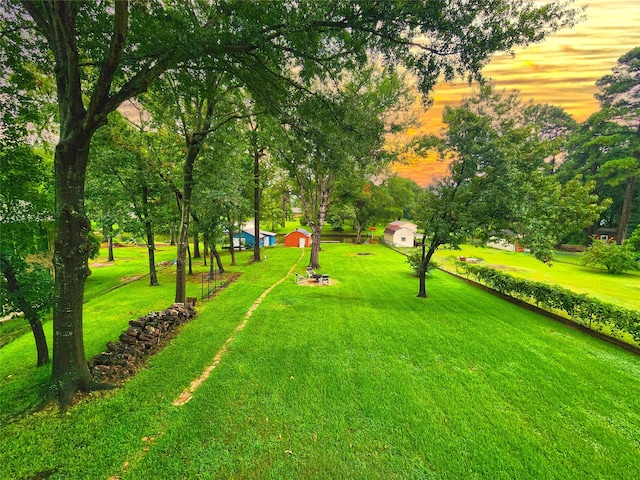 view of home's community featuring a lawn