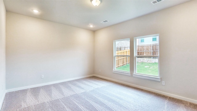 view of carpeted spare room