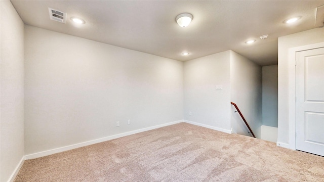 spare room with baseboards, visible vents, carpet flooring, and recessed lighting