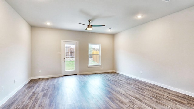 spare room with visible vents, baseboards, ceiling fan, wood finished floors, and recessed lighting