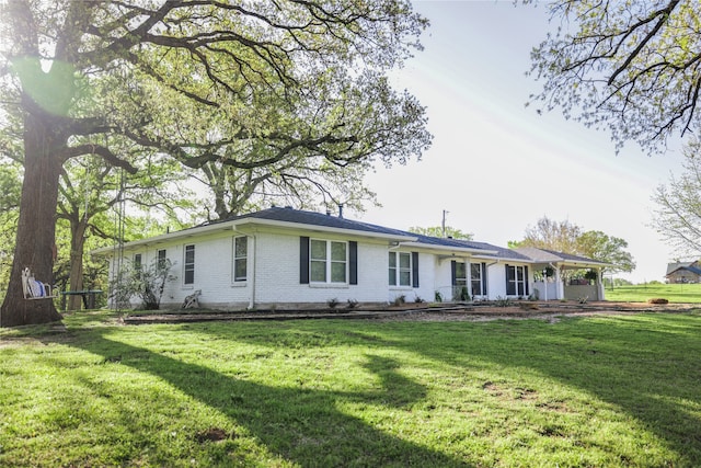 ranch-style house with a front lawn