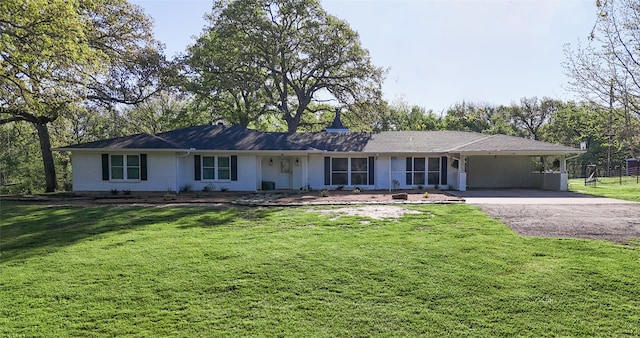 ranch-style house with a front lawn and a carport