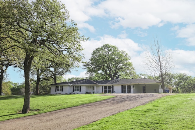 single story home with a front yard