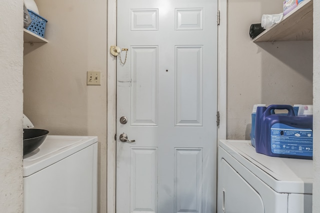 laundry room featuring washer and clothes dryer