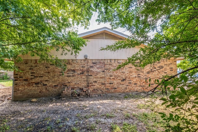 view of home's exterior with brick siding