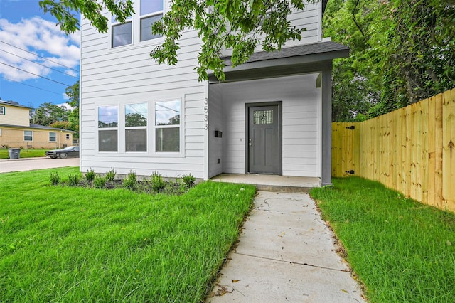 entrance to property with a yard