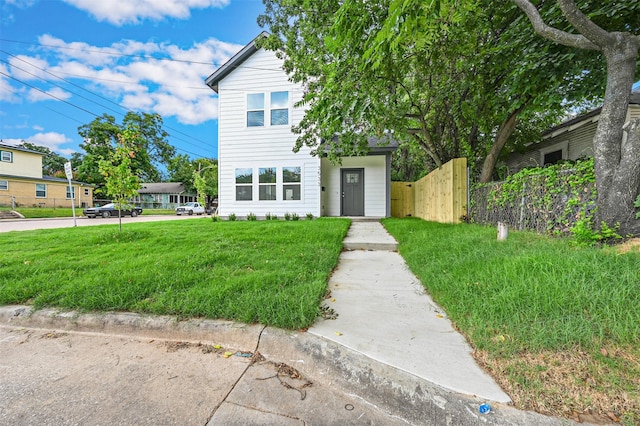 view of front of house with a front lawn