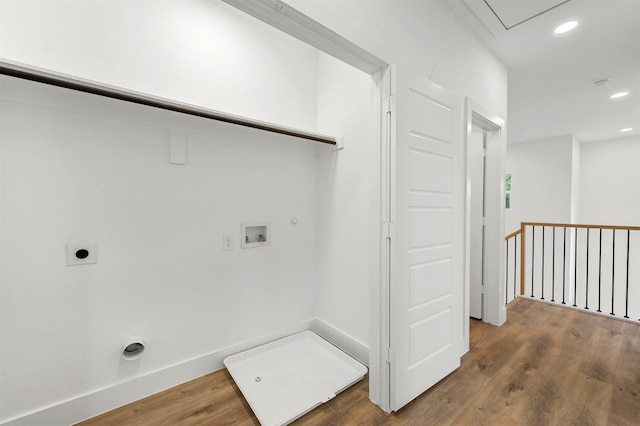 clothes washing area with electric dryer hookup, gas dryer hookup, wood-type flooring, and hookup for a washing machine