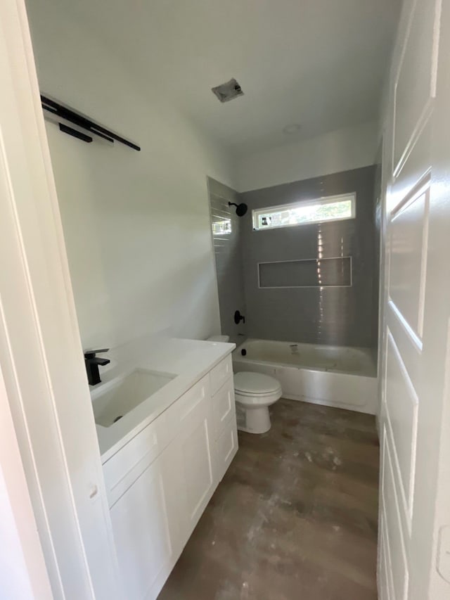 full bathroom with vanity, shower / bath combination, concrete flooring, and toilet