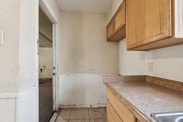 kitchen featuring light tile patterned flooring