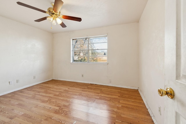 empty room featuring ceiling fan and light hardwood / wood-style flooring