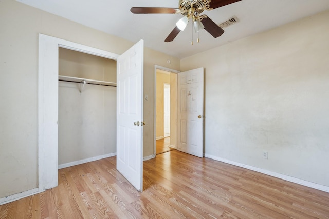 unfurnished bedroom featuring a closet, ceiling fan, and light hardwood / wood-style flooring