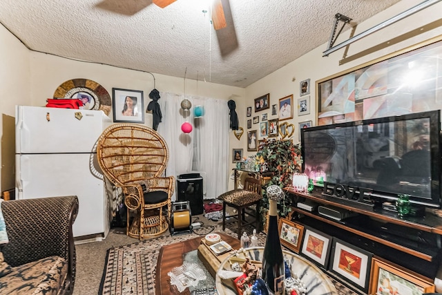 interior space with ceiling fan and a textured ceiling