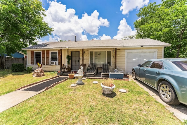 ranch-style home featuring a porch, a garage, and a front lawn