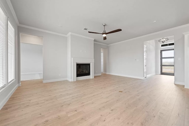 unfurnished living room with ceiling fan, crown molding, and light wood-type flooring