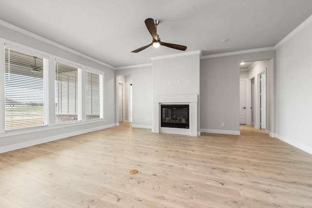 unfurnished living room featuring light wood-type flooring, ceiling fan, and crown molding