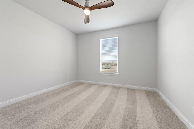 spare room featuring carpet flooring and ceiling fan