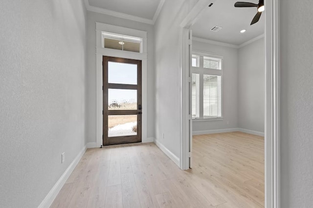 entryway featuring light hardwood / wood-style flooring, ceiling fan, and crown molding