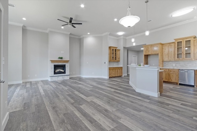 kitchen with dishwasher, light wood-type flooring, ceiling fan, and decorative light fixtures