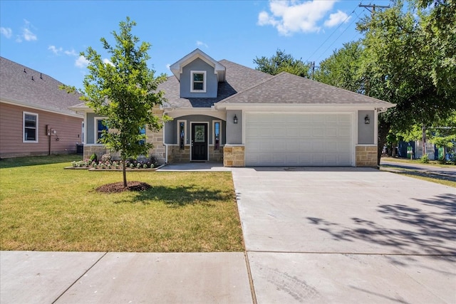 view of front of house featuring a garage and a front lawn