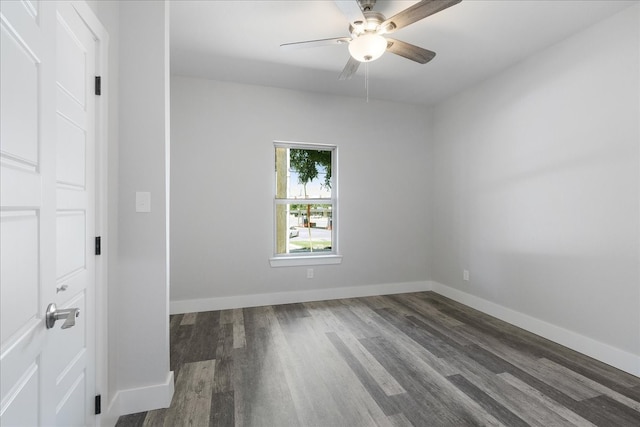 empty room featuring ceiling fan and dark hardwood / wood-style floors