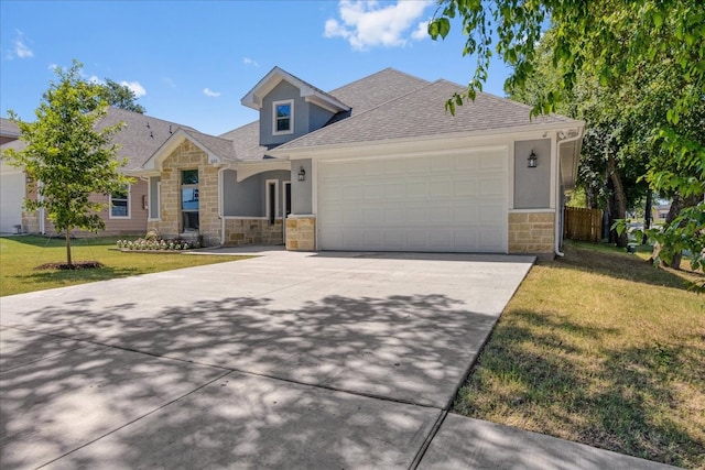 view of front of house with a garage and a front yard