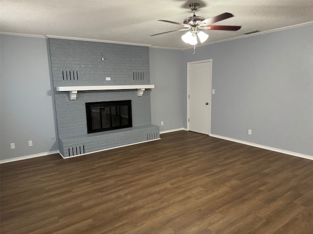 unfurnished living room featuring a textured ceiling, dark hardwood / wood-style flooring, and a brick fireplace