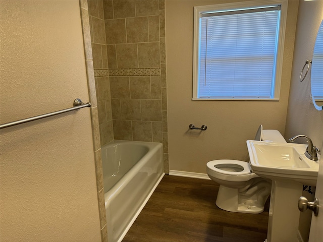 bathroom featuring toilet and hardwood / wood-style flooring