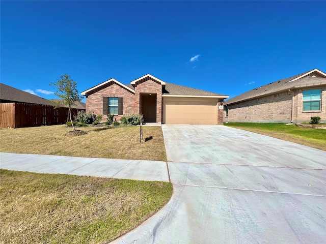 ranch-style home with a garage and a front lawn