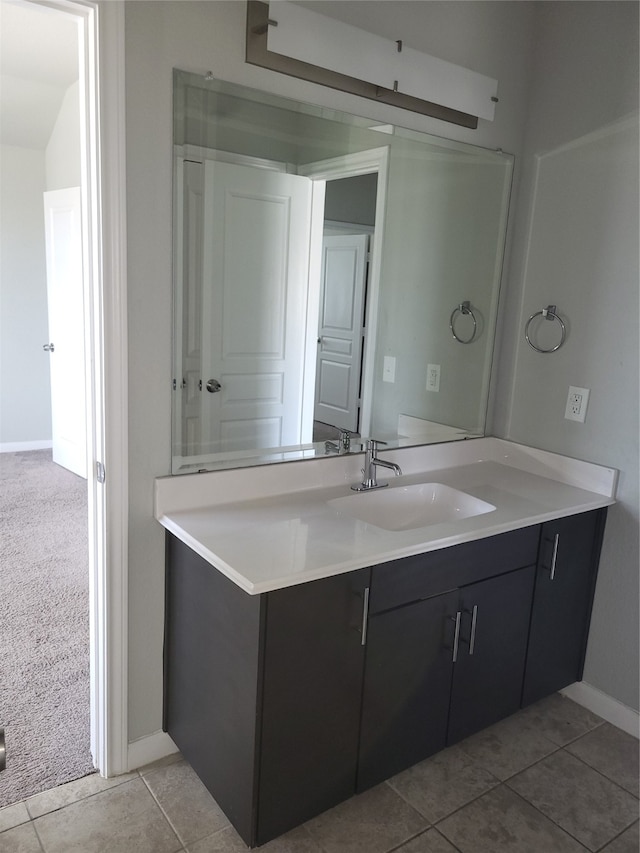 bathroom with vanity and tile patterned flooring