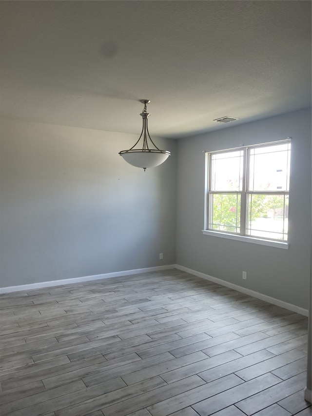 empty room featuring hardwood / wood-style floors