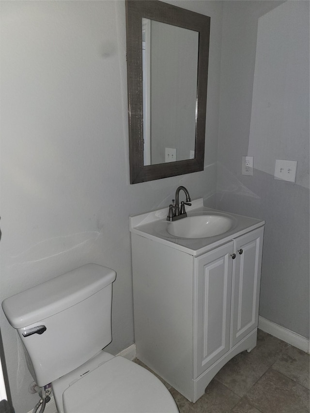 bathroom with tile patterned floors, toilet, and vanity