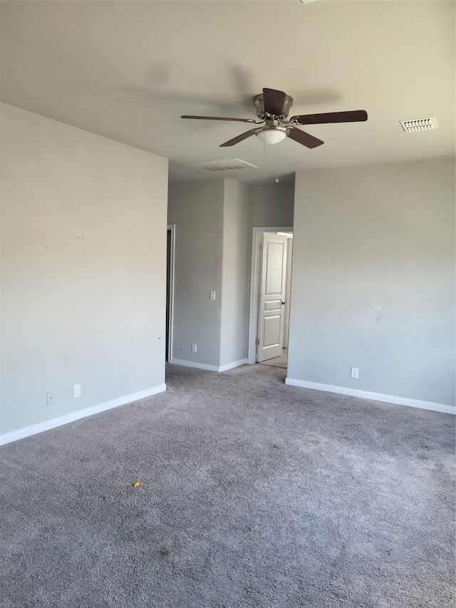 spare room featuring carpet floors and ceiling fan