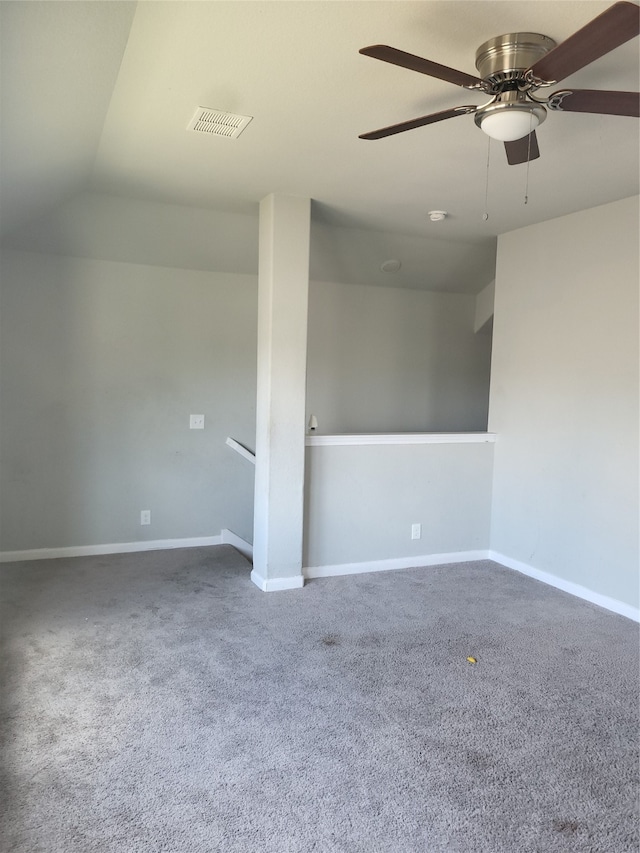 unfurnished room with lofted ceiling, carpet floors, and ceiling fan