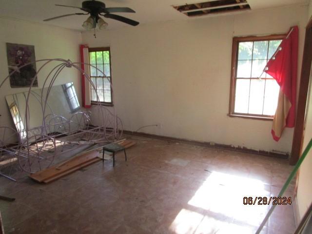 interior space featuring ceiling fan