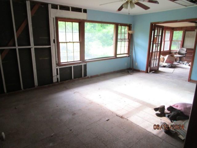 interior space with ceiling fan and a healthy amount of sunlight