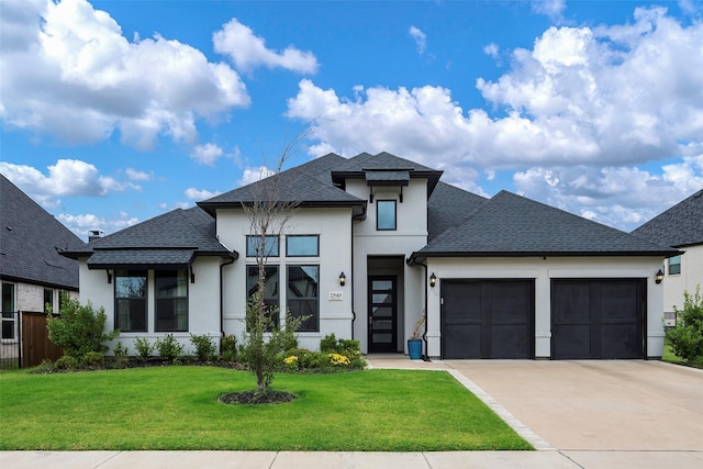 view of front facade with a front yard and a garage