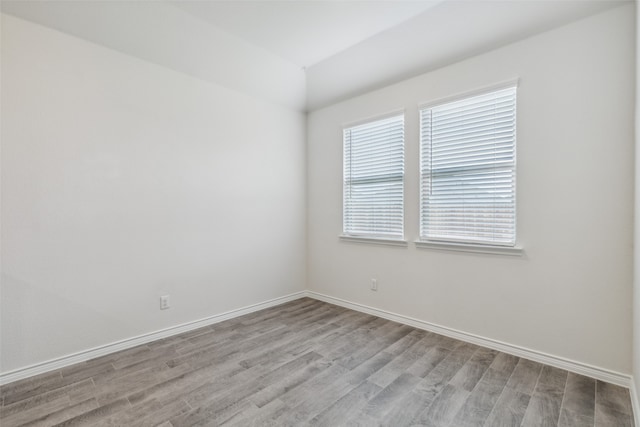 empty room featuring hardwood / wood-style flooring