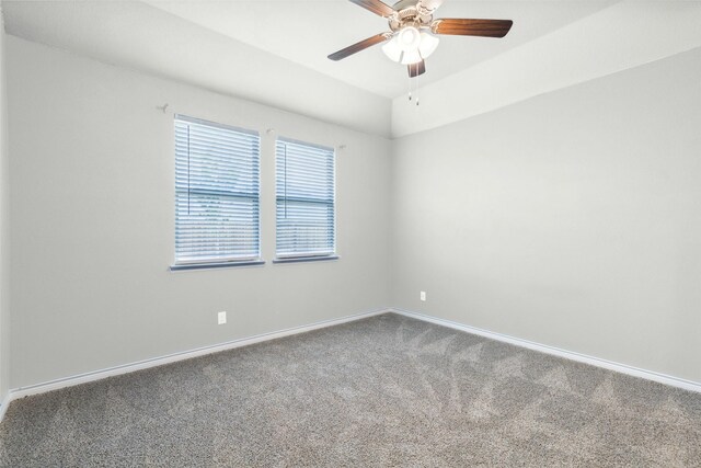 carpeted empty room featuring ceiling fan