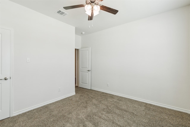 spare room with carpet floors and ceiling fan